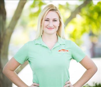 female owner with green shirt