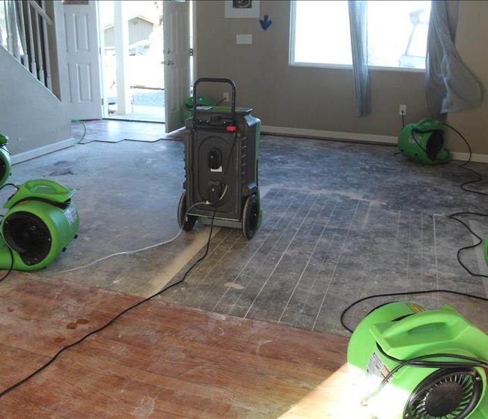 8 green drying equipment placed on concrete, water damage laminate floor removed, moisture walls wet materials in pilot hill 