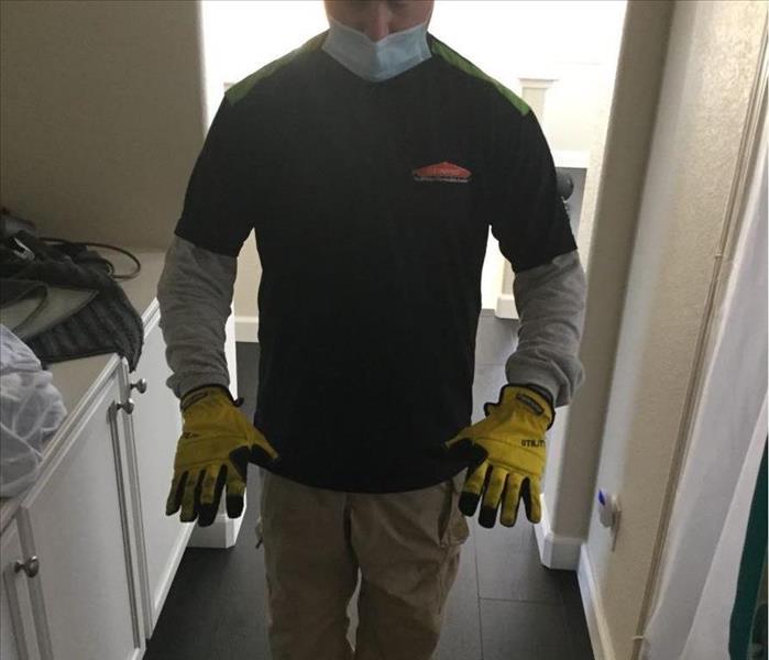 male wearing PPE equipment for biohazard near El Dorado Hills near me